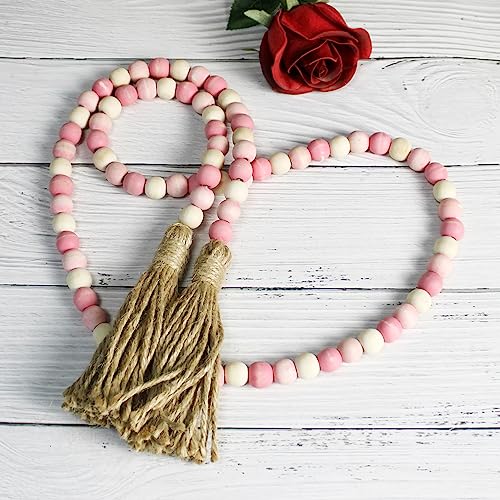 CVHOMEDECO. Wood Beads Garland with Tassels Farmhouse Rustic Wooden Prayer Bead String Wall Hanging Accent for Home Festival Decor. Pink Mix Distressed - color: Pink Mix Distressed